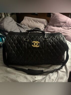 CHANEL Black Quilted Leather Duffel with Gold CC Emblem